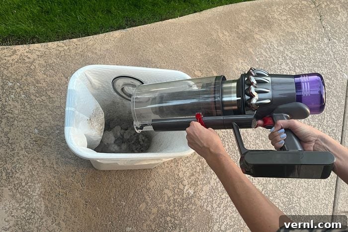 Dyson Outsize Plus empty bin, demonstrating hygienic emptying