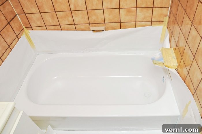 The Ultimate Guide to Tub Reglazing 2 Reglazing A Tub Bathtub Being Renovated And Protective Paper Around The Walls