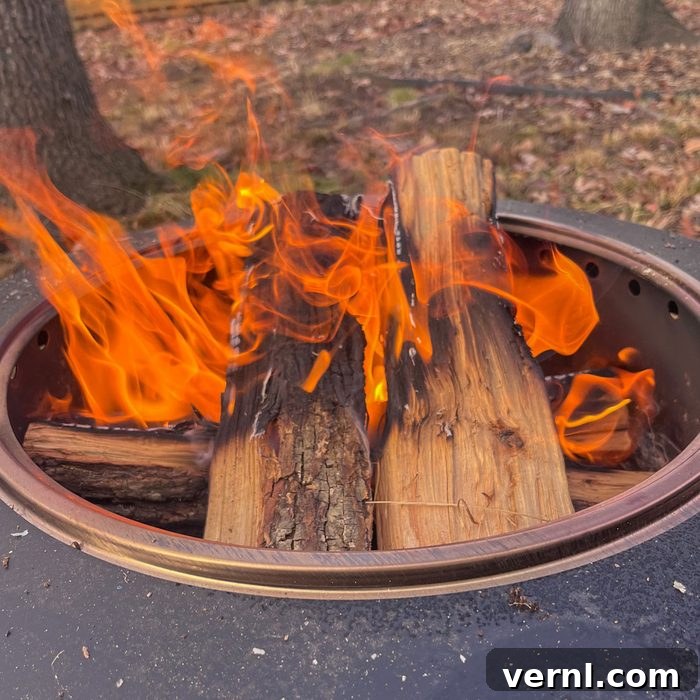 Is This Firewood Subscription the Future for Your Fire Pit and Pizza Oven 4 Cutting Edge Firewood logs burning brightly in a backyard fire pit, demonstrating their clean and long-lasting burn.