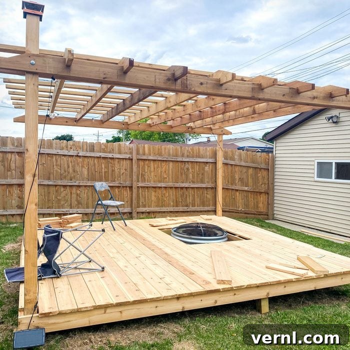 The Eleven Percent: Tonda Thompson, Building Blocks of Wood and Community 2 A beautifully crafted wooden deck with a fire pit in a backyard setting