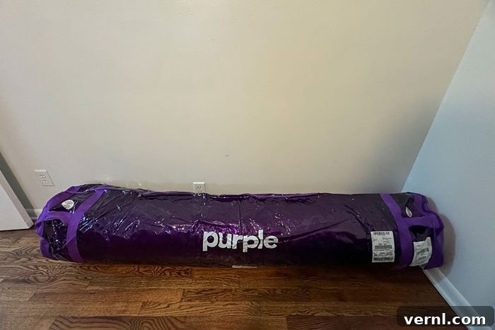 Purple Restore Cool Touch Hybrid Mattress packed up and on floor before setup