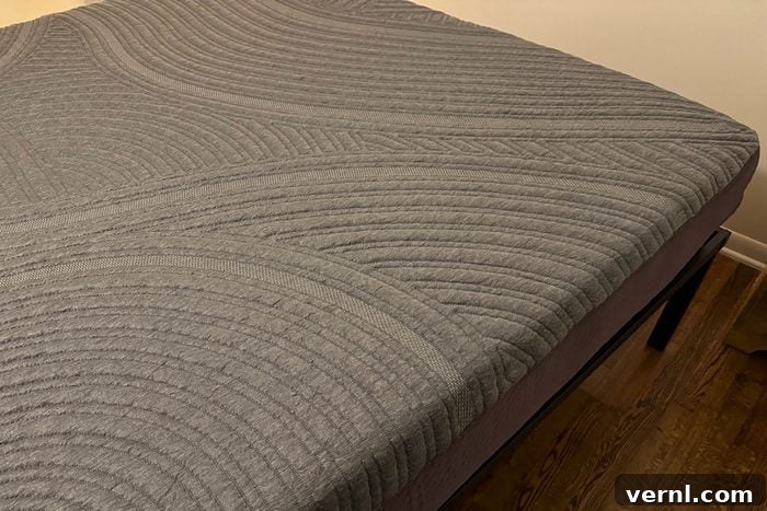 A bed with a Purple Restore Cool Touch Hybrid Mattress on top of it, showing its clean lines
