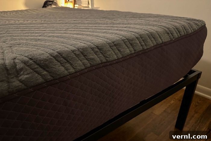 A bed with a Purple Restore mattress on top, showcasing a neatly made bed