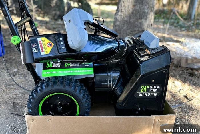 I Put the EGO Cordless Two-Stage Snow Blower to the Test and It Blew Me Away 5 The EGO Snow Blower meticulously packaged on a shipping pallet, ready for unboxing and assembly.