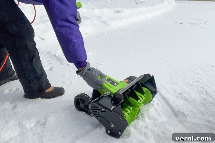 Earthwise Electric Snow Shovel Durability Two Years On 6 A woman cleaning snow with Earthwise Electric Snow Shovel