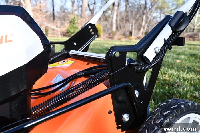 Stihl Electric Mower Unplugged Performance Review 5 A lawn mower with a handle attached to it.
