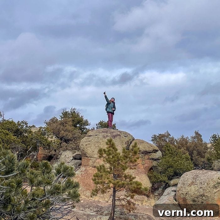 Rocky Talkie: The Clear Choice for Mountain Communication 8 Woman holding Rocky Talkie Rugged Two Way Radio on top of mountain
