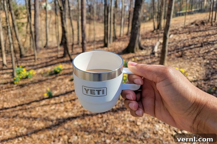 Yeti's Stackable Mugs Your Next Camp Coffee Essential 4 Holding Yeti’s New Stackable Cup in forest area