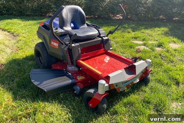 Toro Electric Riding Mower: A Groundbreaking Review 2 A red Toro Electric Zero Turn Mower in front yard