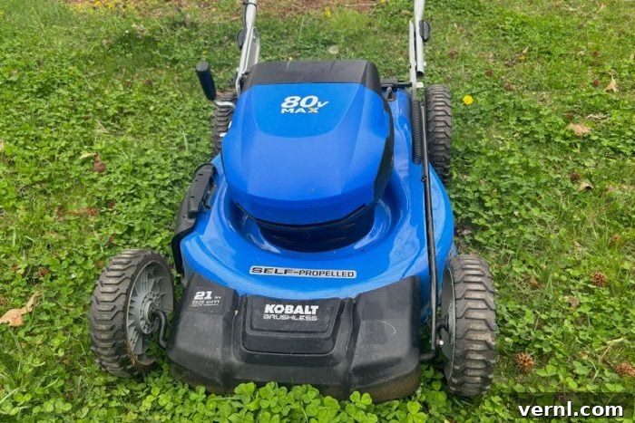 Front side of the Kolbalt Electric Mower, showcasing its sleek design and robust wheels.
