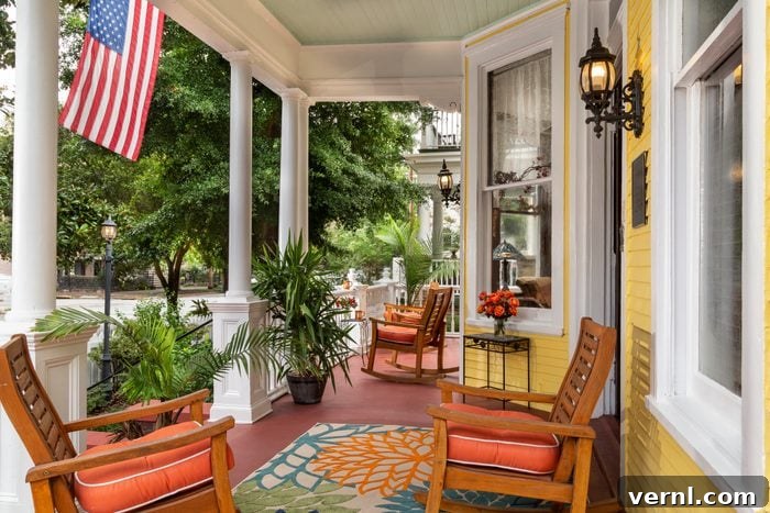 Patio Porch Decoding The Distinctions 3 front porch of yellow house with American flag in summer