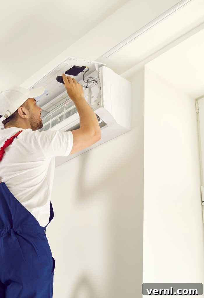 Are Home Warranties a Good Investment 3 Young,technician,uses,screwdriver,and,opens,up,air,conditioner,unit