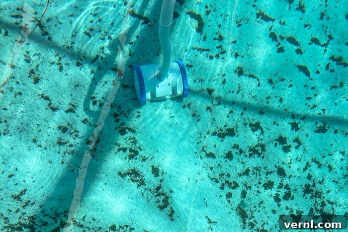Hayward Pool Cleaner expertly cleaning the pool floor underwater, showcasing its efficiency.