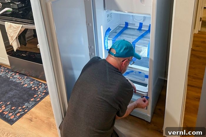 Smeg Fridge Review: Is the Style Just Skin Deep? 4 Man can be seen setting up the Smeg Fab 28 Fridge