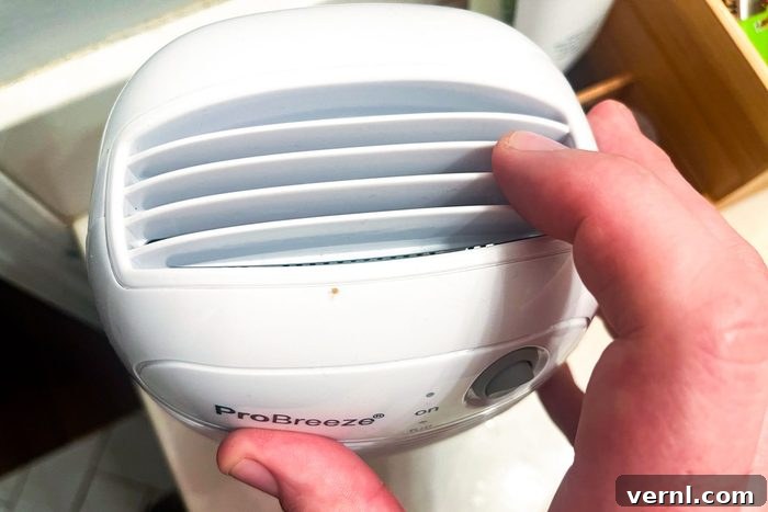 Pro Breeze Dehumidifier A Year In My Honest Verdict 2 Pro Breeze Dehumidifier in a room, emphasizing its compact size and modern design.