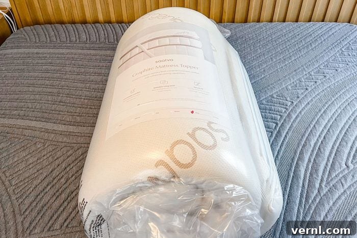 Saatva Graphite Memory Foam Mattress Topper: Instant Sleep Upgrade 3 Compressed and rolled Saatva Graphite Memory Foam Mattress out of the packaging box.