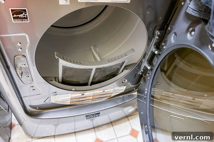 Maytag Washer and Dryer Review Timeless Reliability 5 Maytag front loading washing machine door open, showing the large drum capacity.