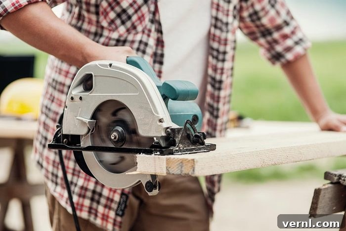 High-End Tools: Overpriced Gimmick or Indispensable Upgrade 2 Experienced craftsman using a circular saw to precisely cut a wooden plank for a woodworking project.