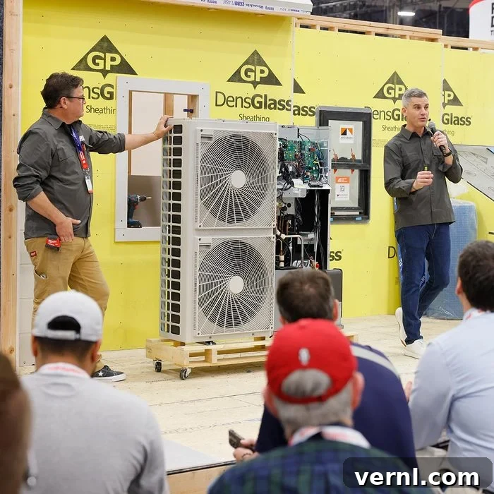 Unveiling 2025's Game-Changing Building, Kitchen & Bath Innovations 2 Two men present an air conditioning system at the NAHB International Builders Show
