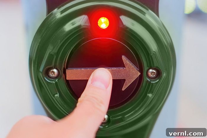 Do Walk Signals Actually Matter? 2 Close-up view of a thumb pressing a pedestrian crossing button