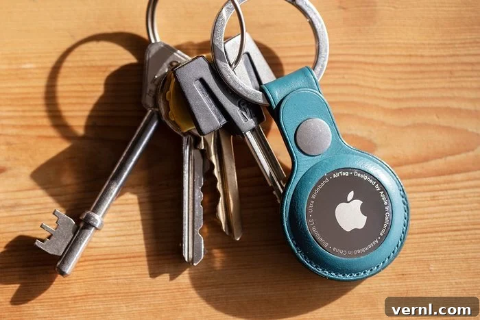 10 Brilliant AirTag Ideas for Your Everyday 2 Apple AirTag device attached to a keychain for easy tracking