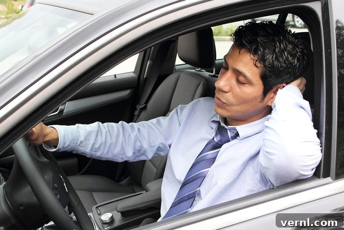 11 Bizarre Driving Laws Still on the Books 4 A driver's hands on a steering wheel, with blurred background, depicting the seriousness of Tennessee's 'no sleeping while driving' law.