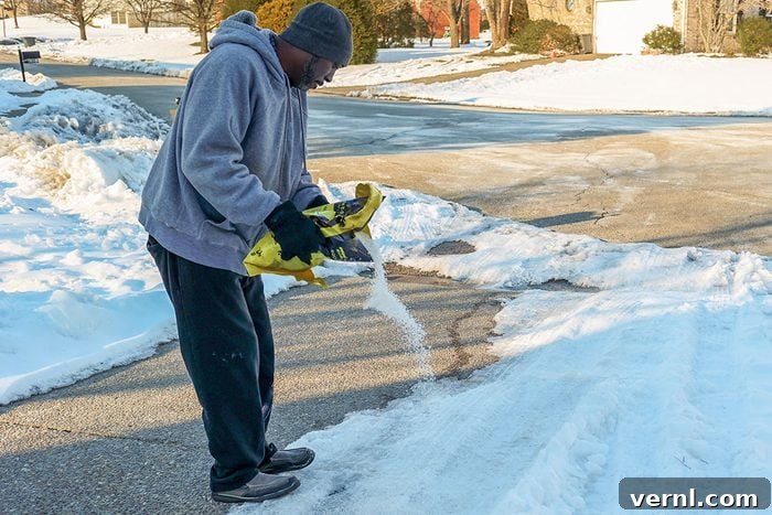 Holiday Safety Blunders to Avoid 5 Man pouring salt on a driveway