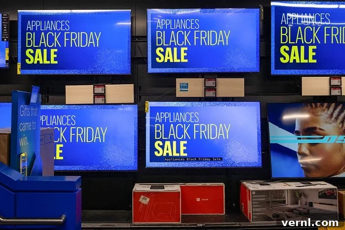 Tariffs Take Aim: Black Friday and Holiday Spending Under Pressure 2 Televisions display a sale message at a Best Buy store on Black Friday, in New York City