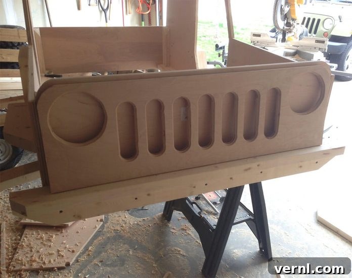 Close-up detail of the partially finished Jeep bed grille, showing the construction and slotted design