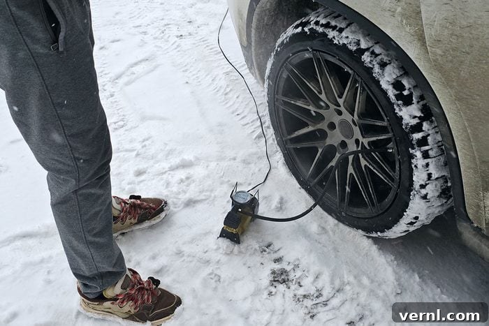 Why Your Tire Pressure Changes and What to Do About It 2 Pumping Car Tire in Snowy Winter Conditions