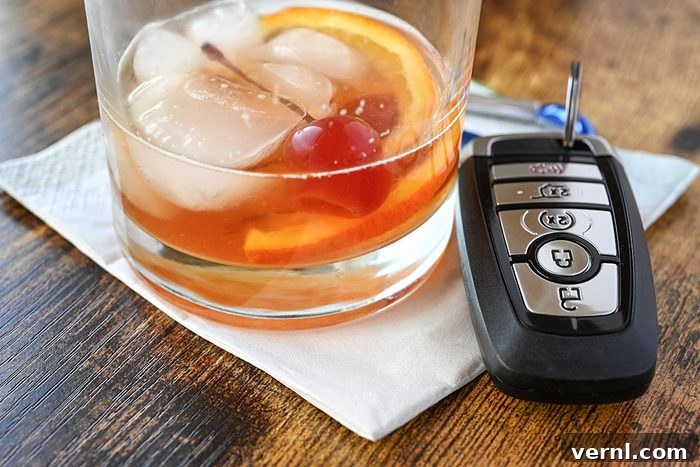 Your Car Soon A Federal Spy Device 2 A mixed drink liquor cocktail with key fob for vehicle at bar