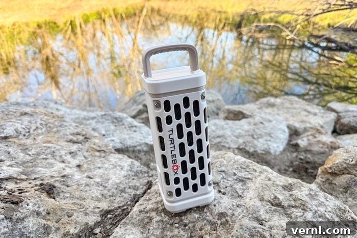 The Unbreakable Sound: Our Deep Dive into the Turtlebox Speaker 3 Turtlebox Ranger on rocks with water and grass in the background