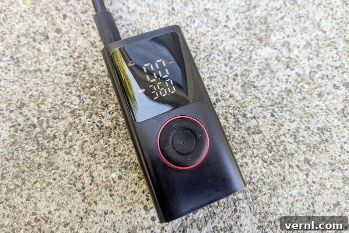Portable Tire Inflator Speed Test: Real-World Fill Times 3 Powools Portable Tire Inflator on a countertop, showcasing its compact design and accessories.