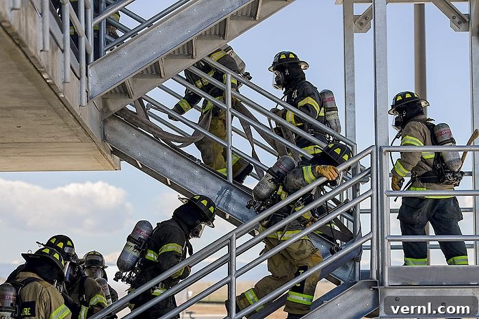If You See a Staircase That Leads Nowhere: What It Means 2 Recruits in the first class of students going through fire training attack the second floor at the Aurora Public Safety Training Center.