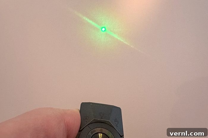 Olight Arkpro Ultra being used as a green laser