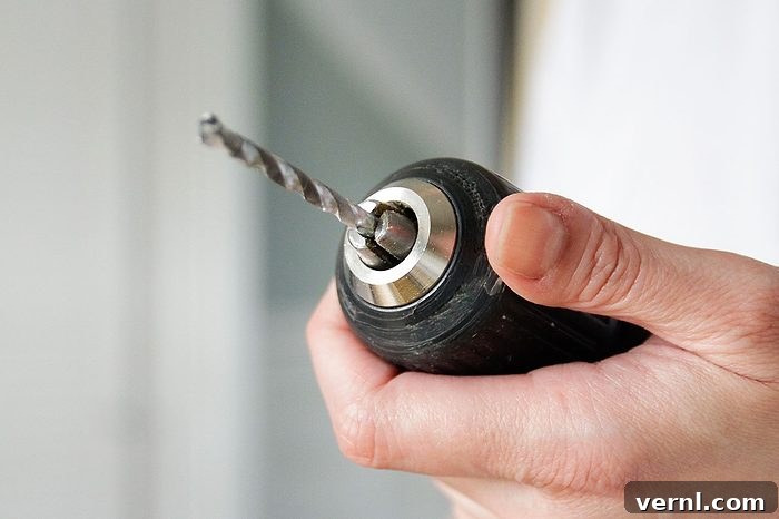 Person holds a drill
