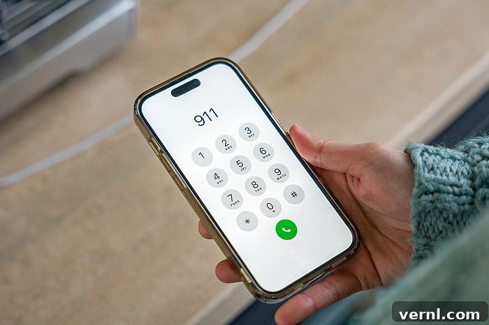 Woman calling 911 emergency number on smartphone