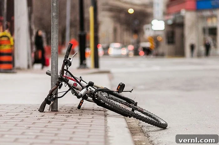 A bicycle has been chained to a post but not in a proper way