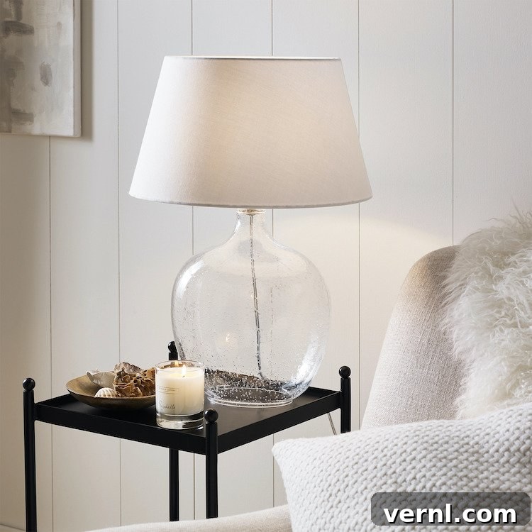 10 Elegant Glass Table Lamps to Brighten Your Home 2 A glass table lamp in a neutral coloured living room.