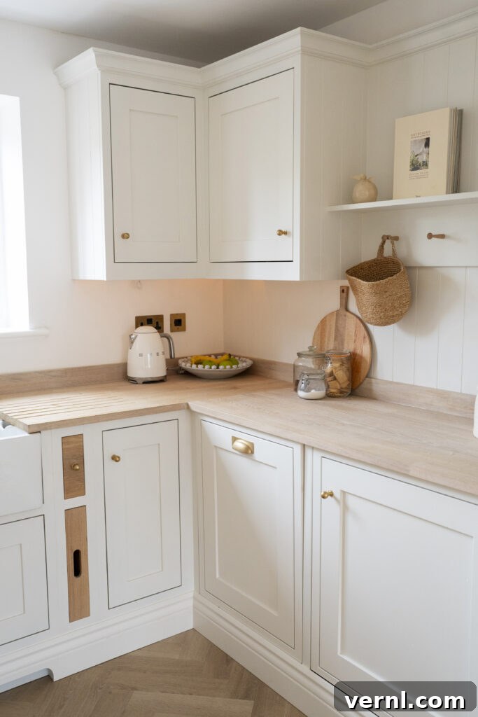 10 Clever Small Kitchen Ideas to Maximize Space and Function 5 A cream small kitchen showcasing cream cabinetry, wooden countertops, and efficient use of corner space with stylish storage solutions, offering practical small kitchen ideas.