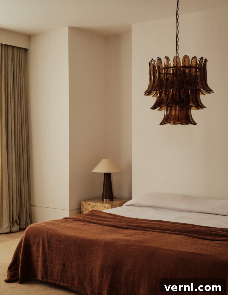 6 Colors That Complement Magnolia Walls for a Timeless Look 10 A cozy bedroom with a magnolia and rust color scheme, featuring a rust-colored linen bedspread, neutral-toned walls, and soft beige curtains.