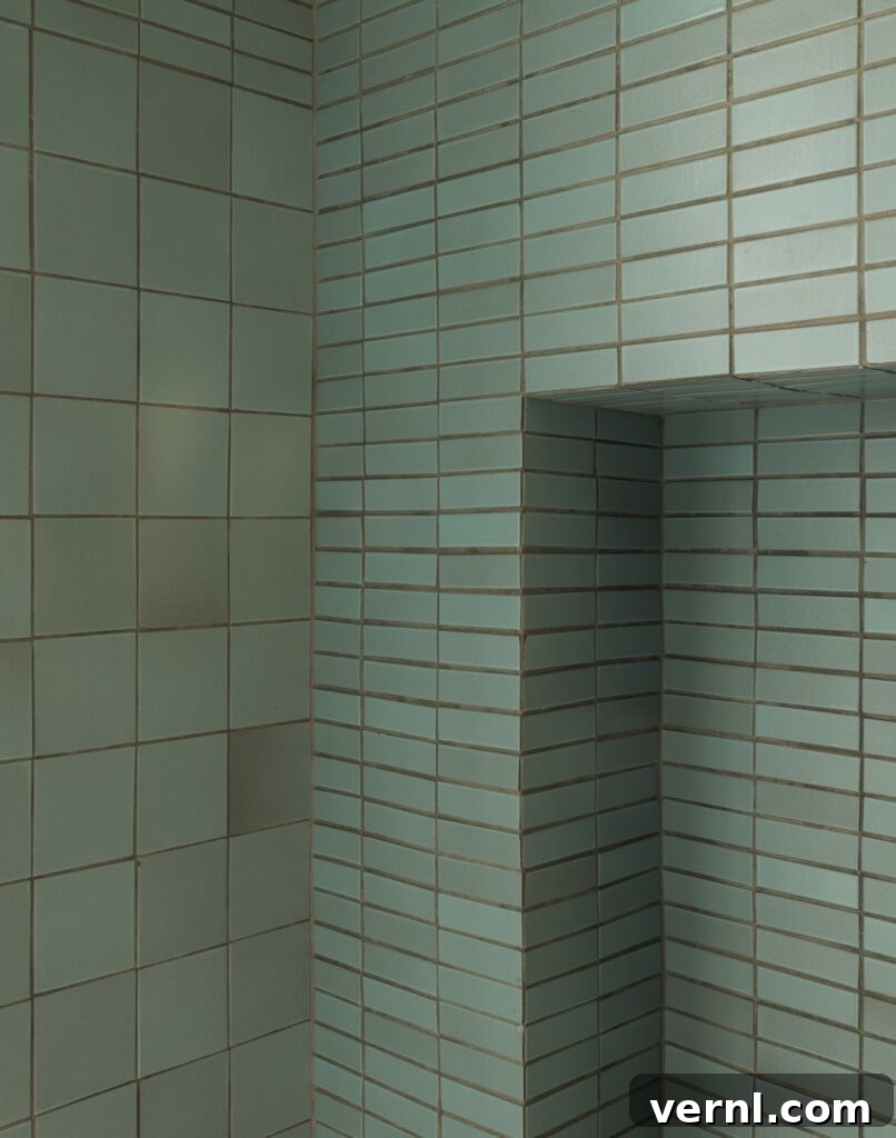 Brooklyn Row House Renovation for Modern Family Living 6 Close-up of green ceramic wall tiles in a modern bathroom with a built-in niche.
