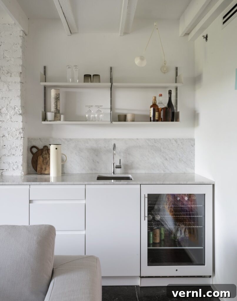 Brooklyn Row House Renovation for Modern Family Living 10
White minimalist kitchen with open shelving, marble worktops.