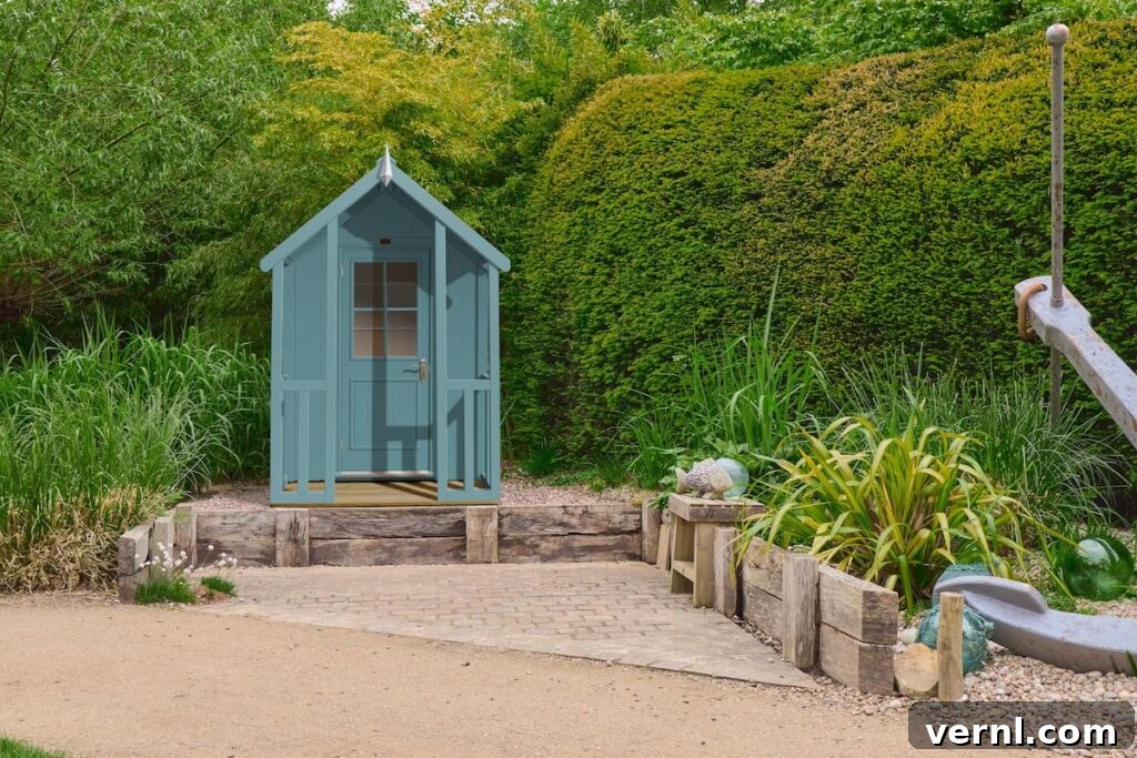 Shed Color Trends 2025 Popular Shades Homeowners Choose 2 A blue garden shed in a lush green landscaped garden.