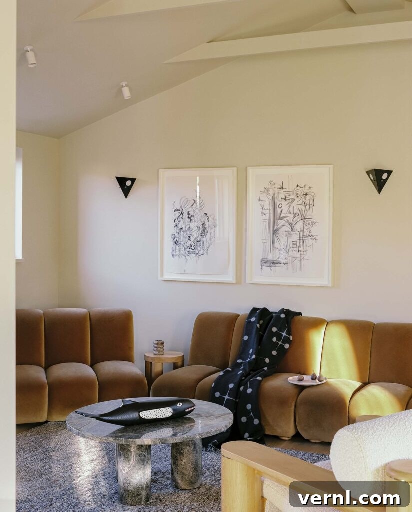 Inside a Dorset Beach House: Modern Coastal Living 4 Caramel-hued living room with velvet seating and contemporary art