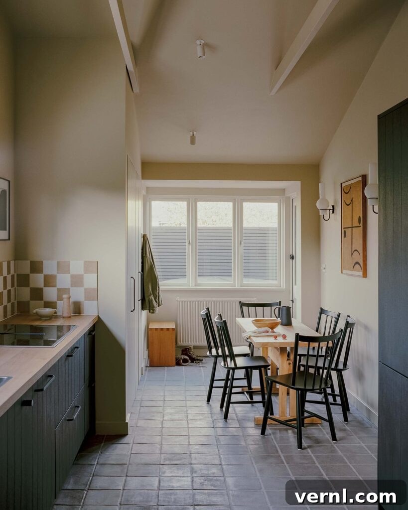 Inside a Dorset Beach House: Modern Coastal Living 6 Tiled galley kitchen opening to dining nook